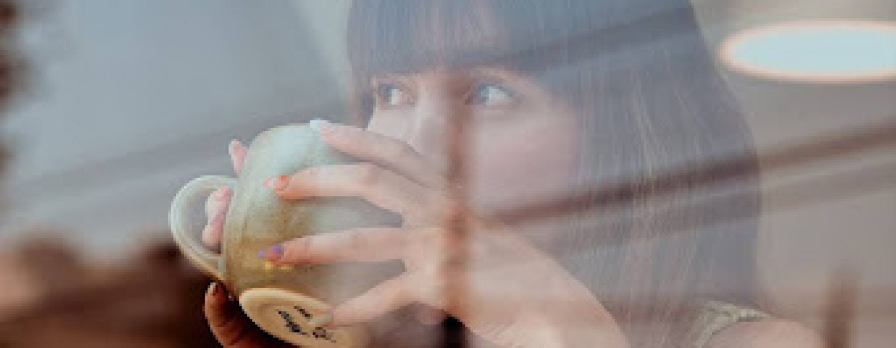 Woman sipping coffee in Seattle WA